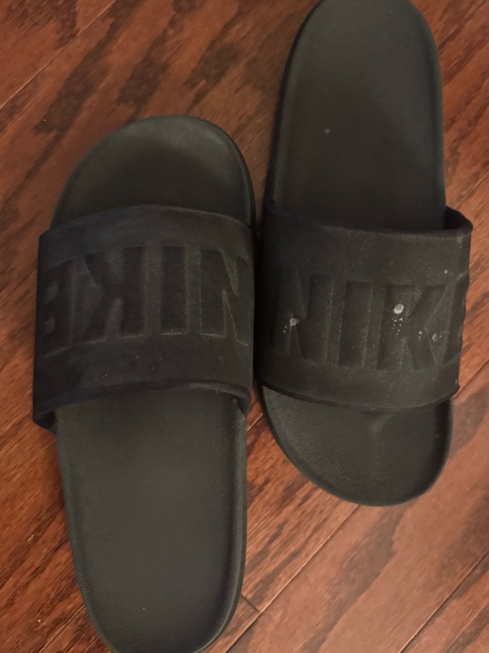 Nike Black Slide Sandals with Embossed Strap